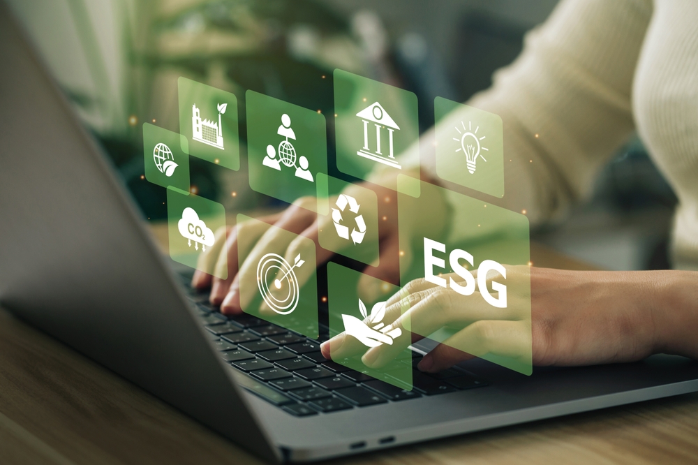 Woman Using Laptop Surrounded by ESG Icons