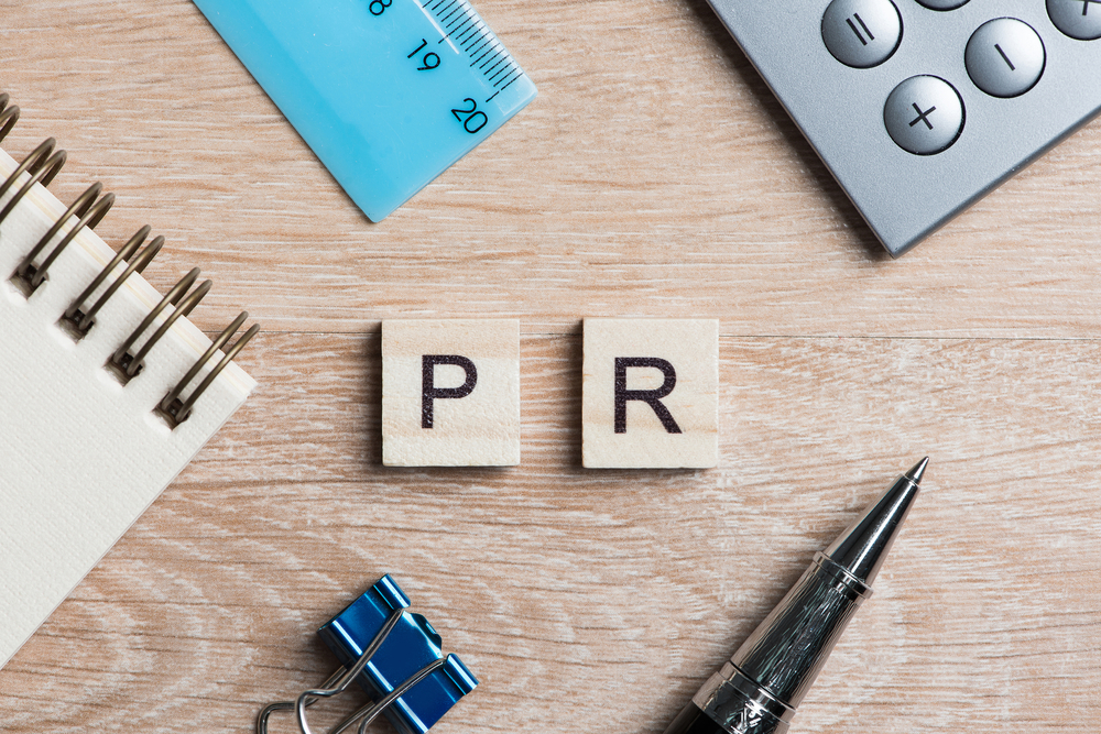 Desk with Wooden Elements with The Letters Forming the Word PR
