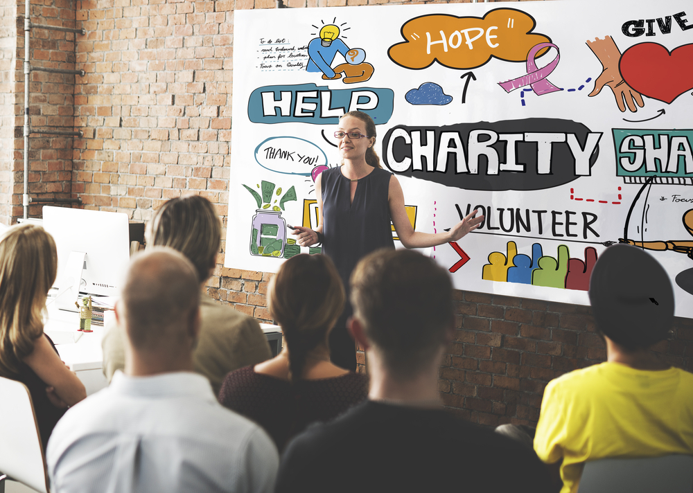 Woman Presenting Around Charity and Volunteerism in a Nonprofit Company Concept