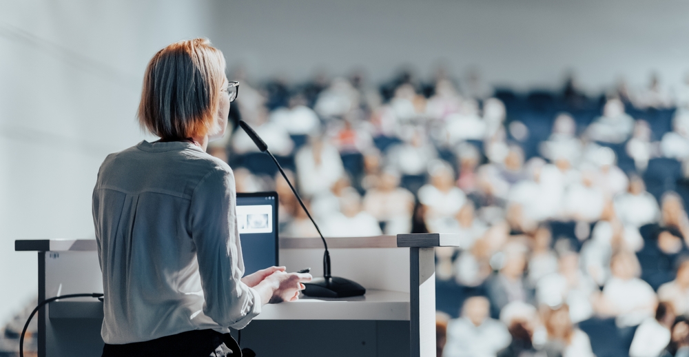 Female Thought Leader Giving a Talk on Corporate Business Conference